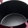 A close-up view of the interior of a burgundy cast-iron pot. Produktbild-Vorschau