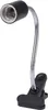 A black and silver clip-on lamp with a flexible gooseneck. Voir les images du produit