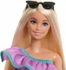 Close-up portrait of a Barbie doll wearing sunglasses and a purple dress. Podgląd zdjęcia produktu