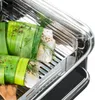 Close-up of fish wrapped in leeks and herbs in a steaming basket. Náhľad obrázku produktu