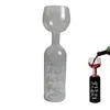 A clear studio shot of a wine bottle shaped wine glass, and a smaller version of the same glass being filled with red wine. Náhľad obrázku produktu