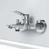 A chrome-plated bathtub faucet mounted on a white wall. Produktbild-Vorschau