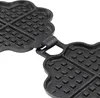 A close-up view of an open cast iron waffle maker with a heart-shaped mold. Produktbild-Vorschau