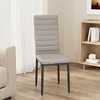 A single gray dining chair with a high back and black legs is shown in a room with a sofa and a bookshelf. Náhľad obrázku produktu