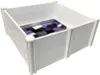 A white plastic dog crate with a patterned blanket inside. Produktbild-Vorschau