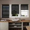 A bathroom setting with a sink and vanity, featuring three windows with black zebra blinds. Voir les images du produit