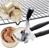 A can opener is shown with several cans, one of which is open and filled with food. Voir les images du produit