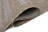 A close-up view of a rolled-up rug, showing its texture and striped pattern. Náhľad obrázku produktu