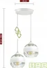 A white ceiling lamp with two glass globes. Produktbild-Vorschau