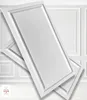 Two white decorative wall panels are shown overlapping each other in front of a wall with decorative paneling. Anteprima dell’immagine prodotto