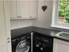 A laundry room with a washing machine and dryer. Podgląd zdjęcia produktu