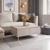 A modern living room scene featuring a couch, coffee table, and ottoman. Náhľad obrázku produktu