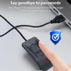 A finger is touching a USB fingerprint scanner connected to a laptop. Produktbild-Vorschau