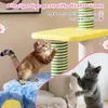 Two cats interacting with a cat tree and a damaged sofa. Podgląd zdjęcia produktu