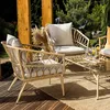 A patio furniture set on a wooden deck with greenery in the background. Náhľad obrázku produktu