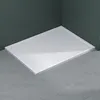 A white shower tray is shown in a bathroom corner, with dark green tiled walls and gray tiled floor. Produktbild-Vorschau