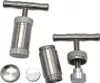 Several parts of a metal pollen press are arranged on a white background. Produktbild-Vorschau