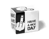 A black and white cube-shaped product with text and graphics on its sides, set against a white background. Náhled obrázku produktu