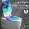 A toilet seat with a beach-themed design is shown on a toilet. Anteprima dell’immagine prodotto