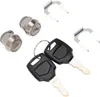 A set of motorcycle top box lock cylinders and keys on a white background. Produktbild-Vorschau