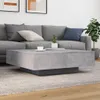 A modern living room scene with a gray sectional sofa and a concrete coffee table. Náhľad obrázku produktu