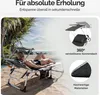 A woman relaxing on a beach chair on a sandy beach. Anteprima dell’immagine prodotto