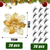 A gold poinsettia decoration with clips and packaging information. Produktbild-Vorschau