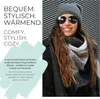 A woman wearing a beanie and scarf, with text overlay describing the product. Produktbild-Vorschau