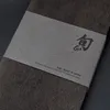 A close-up of a product's packaging, showing branding and material details. Náhled obrázku produktu