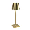 A gold table lamp with a square base and a conical shade is shown against a white background. Anteprima dell’immagine prodotto