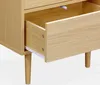 Close-up view of an open drawer on a wooden nightstand with a natural wood effect. Anteprima dell’immagine prodotto