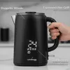 A person's hand is holding a black electric kettle with a digital display showing the temperature. Produktbild-Vorschau