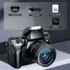 A digital camera with included accessories displayed on a gray background. Produktbild-Vorschau