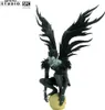 A collectible figure of Ryuk from Death Note, crouching on a skull. Voir les images du produit