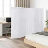 A room divider is shown in a bedroom setting, separating a workspace from a bed. Anteprima dell’immagine prodotto
