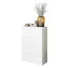 A white chest of drawers with decorative items on top.