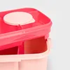A close-up view of two stacked pink plastic lunchboxes. Podgląd zdjęcia produktu