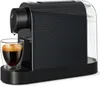 A black Tchibo Cafissimo coffee machine with a glass of espresso in front of it. Produktbild-Vorschau