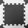 A close-up, top-down view of interlocking foam puzzle mats. Náhled obrázku produktu