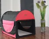 A pet carrier is shown in a room with a vase of flowers in the background. Produktbild-Vorschau