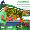 A family playing table tennis outdoors. Produktbild-Vorschau