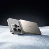 A power bank and a smartphone are placed on a surface that looks like snow, with a dark background. Produktbild-Vorschau