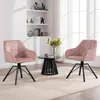 Two pink upholstered chairs with black legs are arranged around a small black table with a vase of flowers on it, in a well-lit room. Náhľad obrázku produktu