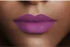 A close-up shot of a person's lips wearing purple lipstick. Náhled obrázku produktu