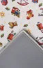 A close-up view of the corner of a rug with a Christmas-themed pattern, showing the underside of the rug. Podgląd zdjęcia produktu