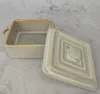 A ceramic baking dish with its lid slightly ajar, placed on a textured surface. Náhled obrázku produktu