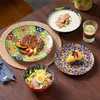 A table setting with various dishes and drinks, showcasing a complete dinnerware set. Náhled obrázku produktu