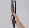 A hand holding a black and rose gold hair straightener against a plain gray background. Náhľad obrázku produktu