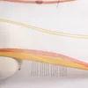A close-up view of a sheer curtain with wavy orange and yellow stripes, partially covering text on a white background. Produktbild-Vorschau