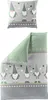 A pillow and a folded duvet cover with a gnome and star pattern. Produktbild-Vorschau